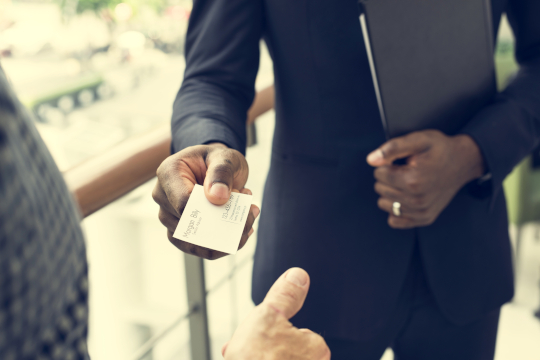 Person giving business card